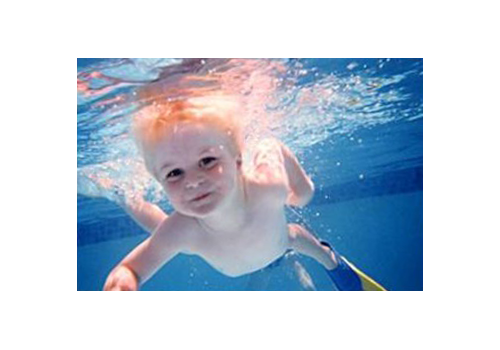 Boy Swimming Baby Barrier Pool Fence of Central Florida Premier Pool Safety Fence